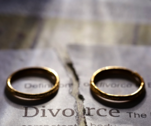 Divorce paper and two wedding rings